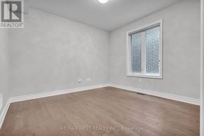 Vaughan (Kleinburg) apartment for rent - A room with a window and wooden flooring.
