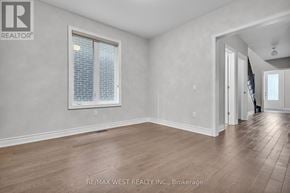 Vaughan (Kleinburg) apartment for rent - A room with a window and wooden flooring.