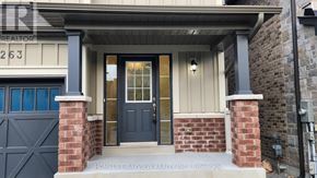 Innisfil (Lefroy) apartment for rent - A house numbered 263 is shown with a dark blue door and brick pillars.