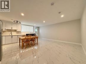 Burnaby apartment for rent - A spacious kitchen with a dining table and chairs.