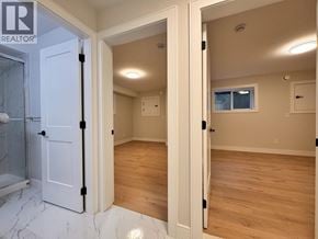 Burnaby apartment for rent - A bathroom with a marble floor and wooden flooring in a house.