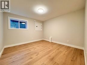 Burnaby apartment for rent - A room with wooden flooring and a window.