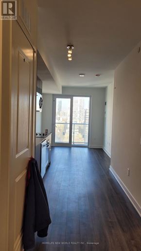 Toronto (Church-Yonge Corridor) condo for rent - A hallway with a coat hanging on the door.