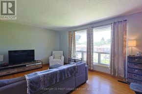 London South (South J) apartment for rent - A living room with a grey couch and a television.