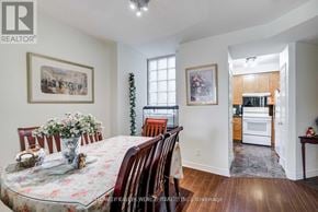 Toronto (Church-Yonge Corridor) condo for rent - A dining room with a floral tablecloth and chairs.