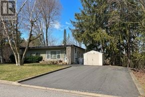 Caledon (Caledon East) apartment for rent - A house with a driveway in front of it is for sale.