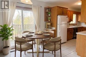 Caledon (Caledon East) apartment for rent - A dining room with a table set for two with a view of the backyard.