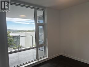 North Vancouver apartment for rent - A room with a large window and a sliding glass door.