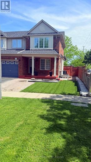 Milton (Be Beaty) apartment for rent - A house with a red brick exterior and a grey roof.