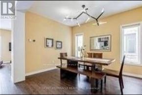 London North (North B) apartment for rent - A dining room with a wooden table and chairs.
