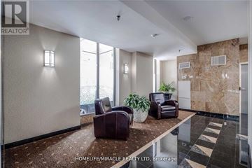 Toronto (Church-Yonge Corridor) condo for rent - A living room with a brown couch and a plant.