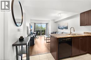 Guelph condo for rent - A modern kitchen with brown cabinets and a black dishwasher.