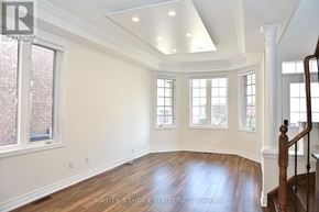 Markham (Cachet) apartment for rent - A spacious room with a staircase on the right and a window on the left.