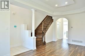 Markham (Cachet) apartment for rent - A wood staircase with white railings in a house.