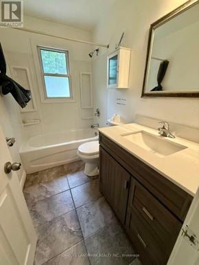 Oshawa (Vanier) apartment for rent - A bathroom with a toilet, sink, and tub.
