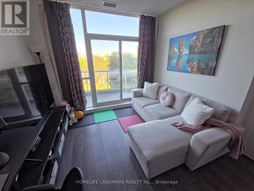 Toronto (Henry Farm) condo for rent - A living room with a grey couch and a painting on the wall.
