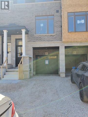 Hamilton (Stoney Creek) townhouse for rent - A car is parked in front of a building with a sign that says REALTOR.