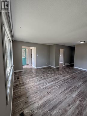Woodstock (Woodstock - South) apartment for rent - A room with wooden flooring and a white ceiling.