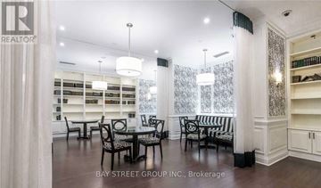 Toronto (Newtonbrook West) condo for rent - A dining room with a glass table and chairs.