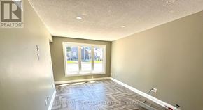 St. Catharines (Burleigh Hill) apartment for rent - A room with a window and a tiled floor.