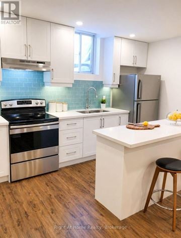 Toronto (Malvern) apartment for rent - A kitchen with white cabinets and a wooden island.