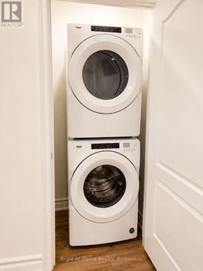 Toronto (Malvern) apartment for rent - Two white front loading washing machines in a small laundry room.
