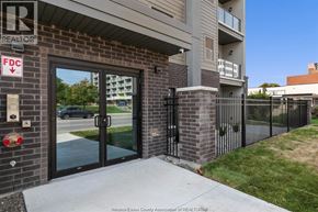 Windsor condo for rent - A building entrance with a sign that says REALTOR.