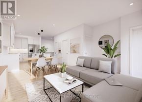 London South (South U) townhouse for rent - A modern living room with a grey sofa, a coffee table, and a dining table with chairs.