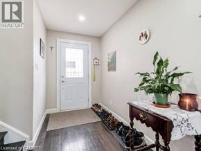 Hamilton apartment for rent - A hallway with a table and shoes on the floor.