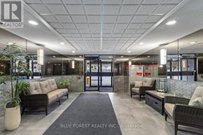 London North (North C) condo for rent - A real estate office lobby with a black and white color scheme.