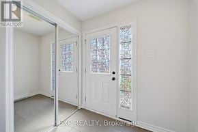 Ottawa townhouse for rent - A white door with a glass window is in a room with white walls.