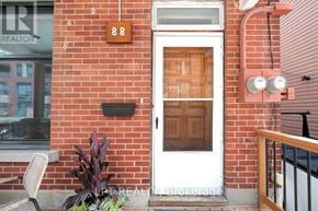 Ottawa duplex for rent - A white door with a brown window above it.