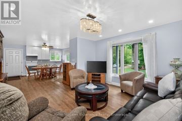 Midland apartment for rent - A living room with a brown leather couch and a wooden coffee table.