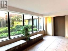 Richmond apartment for rent - A room with a window seat and a potted plant.
