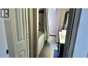 North Vancouver apartment for rent - A bathroom with a toilet, sink, and shower.