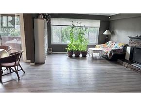 North Vancouver apartment for rent - A living room with a couch, chair, and potted plant.
