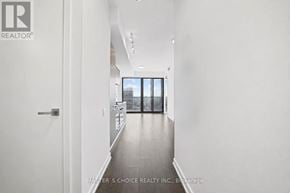Toronto (Church-Yonge Corridor) condo for rent - A hallway with a door on the left and a balcony on the right.
