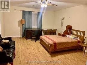 Whitchurch-Stouffville apartment for rent - A bedroom with a bed, chair, and a teddy bear.