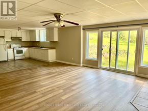 Whitchurch-Stouffville apartment for rent - A room with a ceiling fan and sliding glass doors.