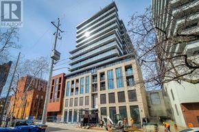 Hamilton (Beasley) condo for rent - A construction site with a tall building under construction in the background.