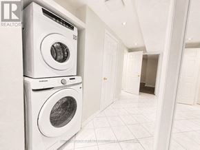 Mississauga (East Credit) apartment for rent - A white Samsung washing machine and dryer in a laundry room.