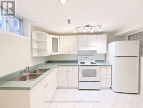 Mississauga (East Credit) apartment for rent - A kitchen with white appliances and cabinets.