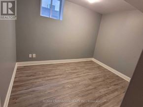 Mississauga (Hurontario) apartment for rent - A room with wooden flooring and a window.