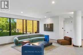 Toronto (Banbury-Don Mills) condo for rent - A room with a large window overlooking a cityscape.