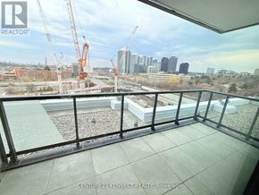 Toronto (Don Valley Village) condo for rent - A balcony with a view of a construction site and buildings in the distance.
