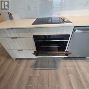 Toronto (Clairlea-Birchmount) condo for rent - A modern kitchen with a white countertop and a stainless steel oven.