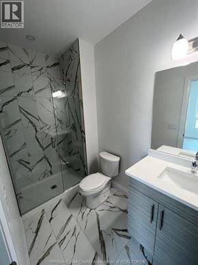 Windsor condo for rent - A bathroom with a marble floor and a walk-in shower.
