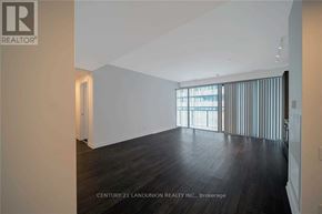 Toronto (Church-Yonge Corridor) condo for rent - A spacious room with wooden floors and a large window with vertical blinds.