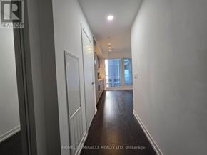 Toronto (Humewood-Cedarvale) condo for rent - A long hallway with a door at the end.