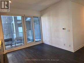Toronto (Humewood-Cedarvale) condo for rent - A room with a window and a sliding door.